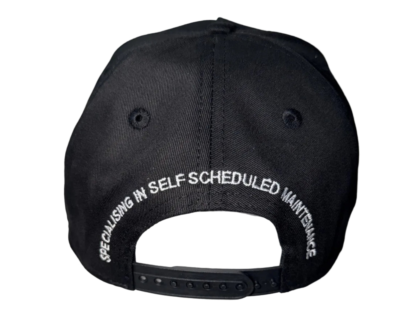 Black baseball cap shown from the back. The cap features white embroidered text reading 'SPECIALISING IN SELF SCHEDULED MAINTENANCE' around the back panel.