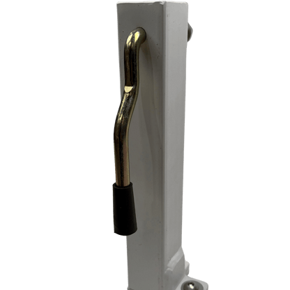 Side profile of the tray side shortening upright  a white steel rectangular post with a chrome S-shaped locking handle threaded through a vertical slot and a black rubber tip at the lower end, photographed against a black background.