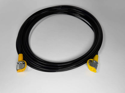 The Stauff Test Hose, featuring a coiled black design with yellow and silver metal ends, is displayed on a plain white surface.