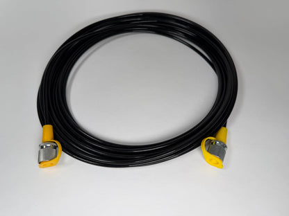 A coiled Stauff to Stauff style test hose (5m) from Stauff, with black cable and yellow-silver metal ends, displayed on a plain white surface.